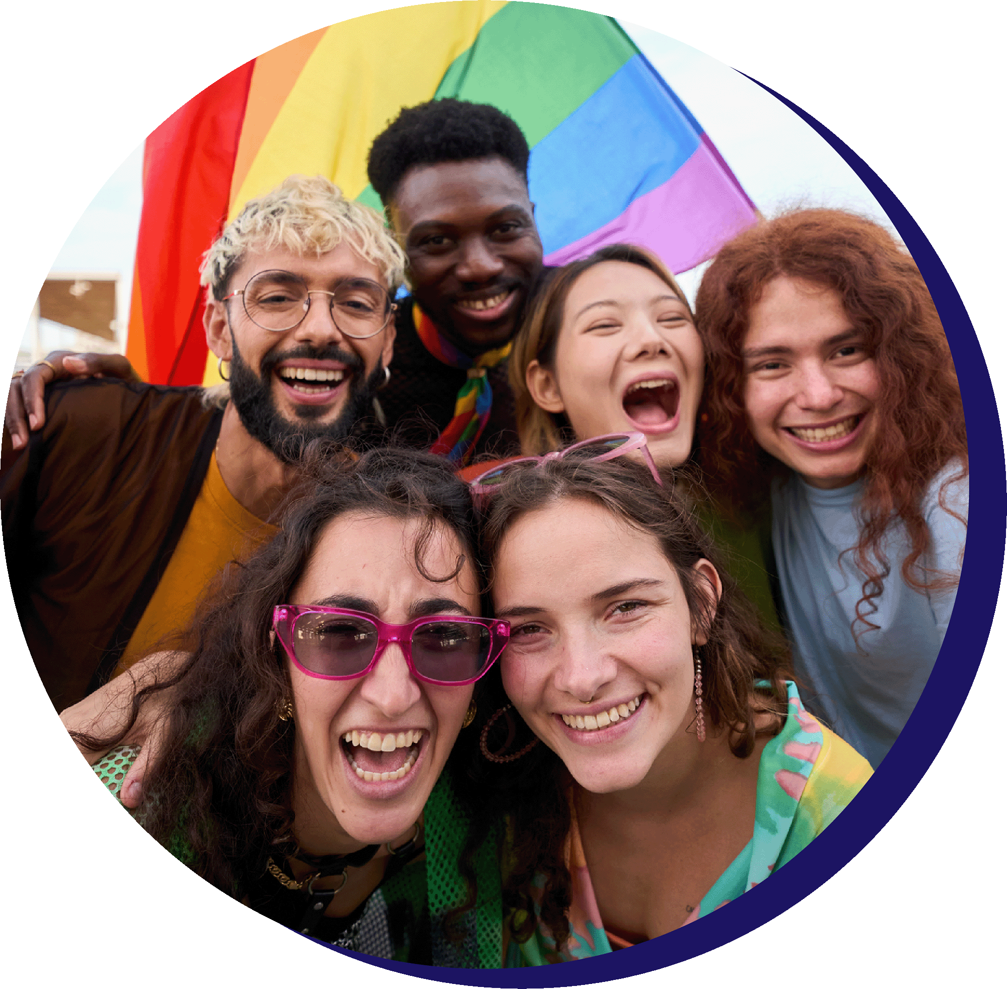 Diverse group celebrating with a rainbow flag.