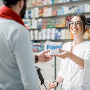 pharmacist selling medications in the pharmacy store